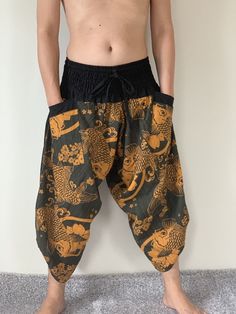 "Mens Japanese Samurai Style Japanese Casual, Harem Baggy Hakama cotton Pants Samurai Pants - elastic waistband Fits all! Unisex pants These beautiful casual pants is unique & comfortable to wear Handmade with a very lovely pattern, it is easy to wear and great for many occasions. One size fits most. These pants are great for many different activities like traveling, dancing, going to festivals, rock climbing, yoga, meditation, massage, working out, martial arts, Taichi MATERIAL: 100% Cotton Traditional Cotton Bottoms For Meditation, Cotton Harem Pants With Elastic Waistband For Meditation, Samurai Style, Yoga Harem Pants, Samurai Pants, Handmade Pants, Harem Pants Women, Unisex Pants, Japanese Samurai