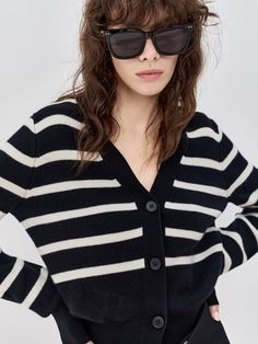 MO&Co. Women's Wool Striped Knit Cardigan Features : - Stripe pattern- Short knitted sweater- V neckline and long sleevesCode : MBC3CART18Length of size M is 51.5cmStripe : Model is 175cm tall and wearing a size M MATERIALS & CARE : Material : 89.2% Wool 10.8% CashmereDo not wash, do not bleachSpread out in the shade to dry, do not tumble dryLow temperature pad ironing, professional dry cleaningPlease select your own size in the size chart according to your figure and serve model size as a guide Classic Striped Winter Cardigan, Striped V-neck Winter Sweater, Striped V-neck Sweater For Winter, Winter Striped Cardigan For Layering, Chic Oversized Fine Knit Cardigan, Striped Long Sleeve Cardigan For Layering, Striped Fine Knit Long Sleeve Sweater, Black Fine Knit Cardigan For Layering, Striped V-neck Sweater For Fall