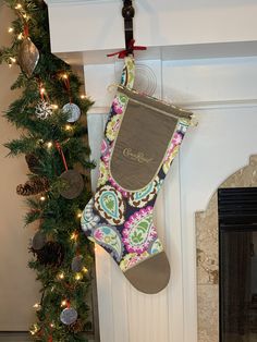 a christmas stocking hanging from a fireplace