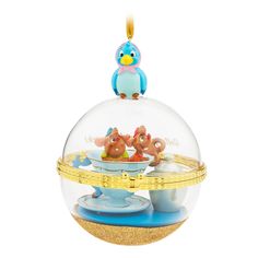 an ornament shaped like a bowl filled with toys