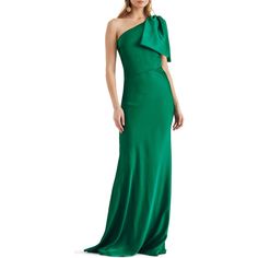 a woman wearing a green dress with one shoulder and an asymmetrical top