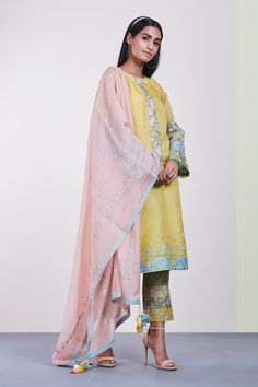 Yellow straight kurta with floral embroidered motifs detail. Paired with pant and dupatta.
Components: 3
Fabric: Chanderi, Organza, Mul
Neckline: Boat
Sleeve Length: Full
Color: Yellow
Embroidered
Tassel detail dupatta 
Embroidered pant
Applique work all over - Aza Fashions Kurta Pant Set, Embroidered Pants, Straight Kurta, Kurta With Pants, Pant Set, Set For Women, Aza Fashion, Saree Designs, Lehenga