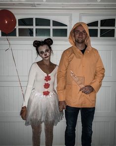 a man and woman dressed up in costumes