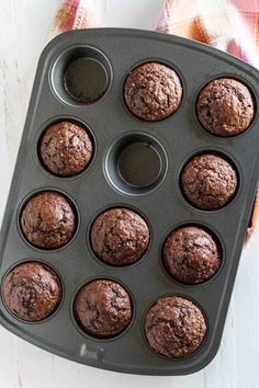 chocolate muffins sitting in a cupcake pan