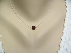 "♥'¨) ¸.*' ¸.**'. (¸.*' (¸.A petite 8mm Siam ruby Swarovski crystal heart rests sweetly on a sterling silver beading chain. This delicate 16\" necklace is closed with a sterling silver lobster claw or spring ring clasp. Simple yet stunning, this would be a perfect gift for a lucky girl. If you need a different chain length, at no additional charge, (up to 20\") just convo me or leave a note in the message to seller. This necklace is also available in gold finish upon request. I can make this nec Heart Shaped Necklace For Wedding On Valentine's Day, Heart Necklace For Valentine's Day Wedding, Heart Necklace For Wedding On Valentine's Day, Heart Necklace For Wedding And Valentine's Day, Wedding Heart Necklace, Red Heart Cut Necklace For Wedding, Heart Pendant Necklace For Valentine's Day Wedding, Heart Cut Jewelry With Heart Beads For Wedding, Delicate Heart Cut Necklace For Wedding