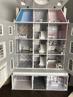 a doll house with all the furniture and accessories in it's display case,