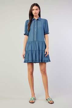 When hot weather hits, it's chambray all day. Get ready with this tiered shirt dress. Relaxed and lightweight, it's got a pointed collar, puffed sleeves, and a swingy shape. Scallop detailing runs along the placket and cuffs. •Pointed collar •Side Pockets •Button placket •Short sleeves •Tiered skirt •Scallop detailing DIMENSIONS •Standard: 35.25" Length Item number 2490161 100% Lyocell Button Down Shirt Dress, Print Trends, Button Down Dress, Sweater Sale, Puffed Sleeves, Shirtdress, Tiered Skirt, Trending Dresses, Sweater Blouse