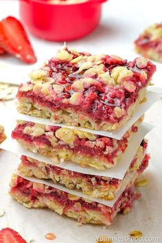 strawberry crumble bars stacked on top of each other