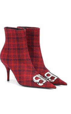 Baleciaga's red and black plaid canvas ankle boots are adorned at the vamp with a silvertone BB logo.Styled with a pointed toe, this pair is finished with a self-covered stiletto heel.3.25"/85mm heel (approximately).4.75"/120mm shaft, 10.00"/25cm circumference (approximately).Pointed toe.Self-covered stiletto heel.Polished silvertone and black hardware.Concealed side zip closure.Lined with leather.Leather sole.Red/Black.Made in Italy. Chevron Outfit, Leather Thigh High Boots, Balenciaga Logo, Black Leather Wedges, Luxury Women Fashion, Un Logo, Black Suede Boots, Red And Black Plaid, Leather Wedges