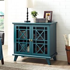 a blue cabinet with glass doors in a living room