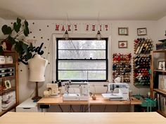 a sewing studio with lots of crafting supplies