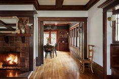 a living room filled with furniture and a fire place