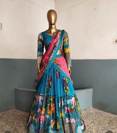 lehenga set  |womens kalamkari lehenga choli |crop top lehenga set |designer kalamkari lehenga dupatta |blue pink  wedding lehenga choli | blue hand painted kalamkari lehenga usa Women's lehenga set /kalamkari embroidered bluelehenga skirt/voggish      lehengas are one of the beautiful and versatile traditional attires of india !! we carry such pieces in budget with great quality that can be styled in multiple ways with different outfits !!       Here is Beautiful lehenga set in blue color and pink color in pure silk hand painted authentic kalamkari set in which skirt has hand painted multi color big border pattern  paired with matching full sleeve hand embroidered and hand painted kalamkari blouse as shown!! This set comes with contrast pink hand painted dupatta with  all over kalamkari h Pink Kalamkari Dupatta, Unstitched Wedding Choli With Kalamkari Print, Unstitched Kalamkari Wedding Choli, Wedding Lehenga With Kalamkari Print In Traditional Drape, Wedding Lehenga With Kalamkari Print, Wedding Dresses With Kalamkari Print, Fitted Kalamkari Print Lehenga For Wedding, Multicolor Floor-length Lehenga With Kalamkari Print, Floor-length Kalamkari Lehenga For Wedding