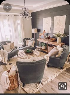 a living room filled with furniture and a chandelier