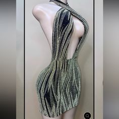 a mannequin wearing a dress with an open back