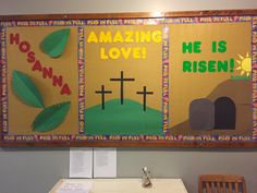 a bulletin board with the words amazing love and he is risen on it in front of a table