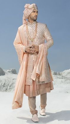 Look gracious in this pink embroidered sherwani along with inner anarkali kurta embellished with sequins. It comes with an embroidered border dupatta and a matching churidar. Shop Pink Wedding Sherwani For Groom Online at Tathastu. Shipping Worldwide | 100% Authentic Wedding Sherwani For Groom, Sherwani For Groom, Embroidered Sherwani, Sherwani Groom, Latest Bridal Lehenga, Pink Plain, Wedding Sherwani, Anarkali Kurta, Embroidered Border