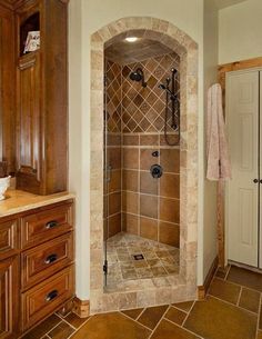 a walk in shower sitting inside of a bathroom