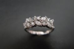 a diamond ring sitting on top of a table