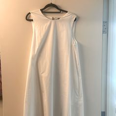 This Never Worn Dress Still Has The Tag On It And Is An Elegant Long Dress White Shift Midi Dress, Shift Midi Dress For Daywear, Elegant Sleeveless Maxi Dress For Daytime, White Cotton Shift Midi Dress, Sleeveless Shift Midi Dress For Day Out, White Shift Dress For Daywear, Unlined A-line Midi Dress For Daywear, Sleeveless Shift Midi Dress For Daywear, Sleeveless Unlined Dress For Brunch