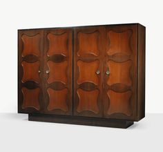 a wooden cabinet with two doors and three shelves on the front, one door is open