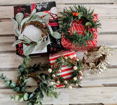 christmas wreaths and wrapped presents on a wooden table