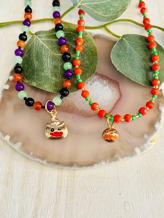 "The adorable beaded pumpkin charm necklace is hand made in the USA. Made with a beaded chain and a lobster claw clasp. This necklace is the perfect accessory for any kids wardrobe.   This necklace is a great kids gift.  The necklace is a length of  Pumpkin 16\" - 18\" Pumpkin Hat 14\" - 16\"" Beaded Pumpkin, Tortoise Shell Bracelet, Ballerina Necklace, Dinosaur Necklace, Pumpkin Hat, Halloween Necklace, Hippie Bracelets, Kids Holiday, Kids Wardrobe