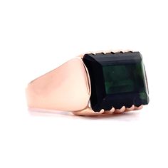 This modern statement ring is sure to turn heads! Crafted from 14 karat rose gold, the piece features an eye-catching East/West set tourmaline. The emerald cut tourmaline has an impressive 10.13 carats of mesmerizing color. The modern ring is finished with a sleek, polished rose gold shank. This ring is a perfect gift to make a statement that won't be forgotten! Modern Emerald Ring With Rectangular Stone, Modern Emerald Ring With Rectangular Stone For Formal, Modern Emerald Ring With Rectangular Stone For Formal Occasion, Modern Rectangular Emerald Ring For Formal Occasions, Modern Tourmaline Rings In Emerald Cut, Modern Tourmaline Rings With Emerald Cut, Modern Tourmaline Emerald Cut Rings, Modern Tourmaline Emerald Ring, Gold Cocktail Ring