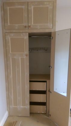 an empty closet is shown with the door open