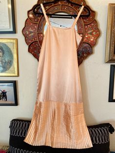 "A silky soft and elegant, rosé midi dress made by the same designer that brought Gunne Sax to San Francisco! Romantic, satiny, pink, dress with beautiful pleats! Sophisticated slip dress that would look great over a tee and worn with some Converse. Styled with a listing called COTTON CANDY  In good vintage condition!!  No noticeable holes, but there is a faint stain on the back, towards the bottom of the dress. Normal vintage wear. Tag Says: 6/fits like a 4/6 Label: Scott McClintock Measurement Silk Pleated Midi Dress For Party, Silk Midi-length Pleated Dress For Party, Pink Silk Midi Dress With Pleated Bodice, Satin Pleated Midi Dress For Evening, Evening Satin Midi Length Pleated Dress, Satin Midi Length Pleated Evening Dress, Satin Pleated Skirt Dress For Summer, Satin Midi-length Pleated Dress For Evening, Silk Midi Dress With Folds For Summer