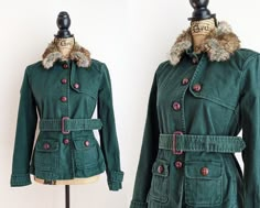 Vintage dark green belted jacket with a faux fur collar, brown knot buttons, and front flap pockets. The jacket features a removable faux fur collar and vest lining. The vest is quilted and lightly padded for additional warmth. The jacket features button-down closure and has two belt loops in the back. The removable belt is a cinch belt with a brown faux leather buckle. Brand: Gap Size: marked size S. Please use the measurements below to ensure an accurate fit. Fabric: 98% cotton, 2% spandex (sh Winter Green Belted Outerwear, Fitted Winter Outerwear With Belt Loops, Green Fall Outerwear With Faux Fur Trim, Cinch Belt, Fur Collar Jacket, Belted Jacket, Gap Jacket, Collar Jacket, Faux Fur Collar