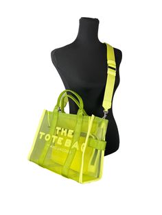 Style: Marc Jacobs The Mesh Tote (Light Green) Material: Nylon Features: Adjustable/Detachable Crossbody Strap, Top Zip Closure, Lined Measures: 16.5" L x 13" H x 6.75" D Green Nylon Shoulder Bag For On-the-go, Green Nylon Shoulder Bag For Shopping, Green Nylon Shoulder Bag With Double Handle, Green Nylon Tote Bag, Summer Nylon Tote Shoulder Bag, Summer Nylon Bag With Double Handle, Nylon Double Handle Bag For Summer, Summer Nylon Shoulder Bag For On-the-go, Packable Nylon Shoulder Bag For Summer