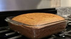 a loaf of bread sitting on top of an oven