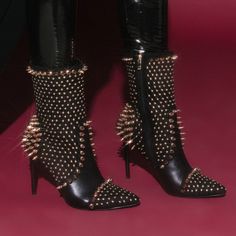 The Azalea Wang Dancin With The Spiked Devil Stiletto Bootie In Black Is An Ultra-Luxe Mid Calf High Boot Featuring A Faux Leather And Suede Upper, Pointed Toe Silhouette, Glossy Stiletto Heel, And Tonal Inner Zipper Closure. Complete With Intricate Studded Detailing Throughout. - All Man-Made Materials - 7” Shaft - 4.5” Heel - Imported Party Heels With Embellished Fit, Embellished Fitted Heels For Party, Black Punk Heels For Evening, Glamorous Heels For Fall Night Out, Elegant Spiked Party Heels, Elegant Spiked Heels For Party, Glamorous Fitted Heels For Fall, Winter Punk Party Heels, Punk Style Winter Party Heels