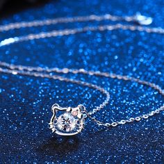 Description & Details Celebrate the elegance and mystique of our feline friends with our exquisite pieces. Each design in our collection is meticulously crafted to capture the grace and playfulness that make cats such beloved companions. • Material: Solid 925 Sterling Silver ∙ Cubic Zirconia• Finish: Hypoallergenic ∙ Gold Plating• Dimensions: 40 - 45 cm chain, adjustable• All our work is custom made by hand with love Hello Kitty Necklace, Kitty Necklace, Beating Heart, Cat Charm, Charm Pendant Necklace, Cat Necklace, The Grace, Rose Gold Necklace, Cute Pink