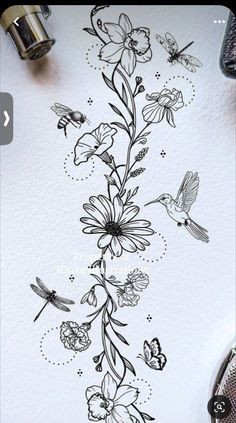 a drawing of flowers and birds on a piece of paper