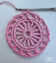 a crocheted circular with a hook on top of it