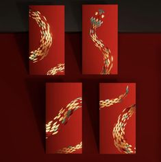 four red cards with gold and blue designs on them, one in the shape of a snake