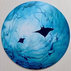 the painting is blue and has two black bats on it