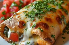 a close up of a plate of food with cheese and vegetables on it's side