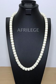 Off-white Nigerian Wedding beads necklace - Afrilege White Jewelry With Oval Wooden Beads, Traditional White Single Strand Beaded Necklace, White Wooden Beaded Jewelry, White Wooden Beads Jewelry, Adjustable Hand-strung White Pearl Necklace, Elegant White Wooden Beaded Necklaces, White Hand-strung Wedding Necklaces, Elegant White Beaded Necklace With Wooden Beads, White Hand-strung Necklaces For Wedding