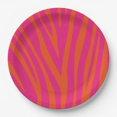 a pink and orange paper plate with zebra stripes