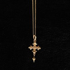 A fusion of medieval aesthetics and tragic beauty, this piece reflects faith's role as a guide through the material world. A tool for divine connection, it embodies reverence while transcending the ordinary. The intricately designed cross, adorned with fleur-shaped extremities, evokes both elegance and the timeless power of protective talismans.  Design: by NOIR KĀLA Material: Brass Size: 1.8 cm x 3 cm Weight: 2 g Tragic Beauty, Medieval Aesthetics, Ear Cuff Piercing, Divine Connections, Material World, Image Model, Cross Jewelry, Cross Pendant Necklace, Jewelry Business