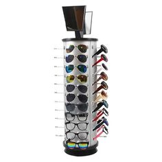 an eyeglass holder with sunglasses on it and several pairs of glasses hanging from the top