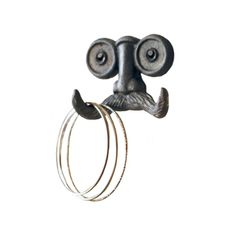 a metal object that looks like a man's face with two eyes and a mustache