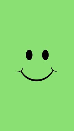 a green background with a smiley face drawn on it