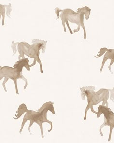 several horses running in the same direction on a white wallpapered room with neutral colors