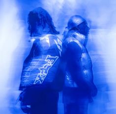 two people standing next to each other in front of a blue background with the words fear written on it