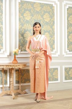 Our beautiful traditional Thai outfits are perfect for weddings, cultural events, Songkran festivals, or any occasion.  They are exclusively handmade with premium Thai silk & handwoven fabric. This set includes: 1 Free Size Silk Sabai Top 1 Free Size Patterned Skirt (can be worn with safety pins or hooks) 1 Set of hooks   This set does not include jewelry or accessories, they are available separately in our store. -- Check out our YouTube videos on how to wear your Thai dress: www.youtube.com/watch?v=jndYR-WrOuE www.youtube.com/watch?v=Eki5aUTxBBI&t=28s -- ชุดไทย, Thai attire, Thai costume, traditional Thailand clothing, that outfit, traditional Thai outfit, traditional Thai clothing, chut Thai, Thai wedding attire, Thai wedding dress, Thai traditional dress, Cambodian dress, Khmer dress, Khmer Traditional Dress Wedding Attire, Traditional Thai Dress, Thai Outfits, Thailand Outfit, Cambodian Dress, Traditional Thai Clothing, Thai Wedding Dress, Thai Clothes, Wedding Dress Jewelry