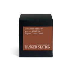 the ranger station soap bar is in a black box with brown lettering on it and an orange label